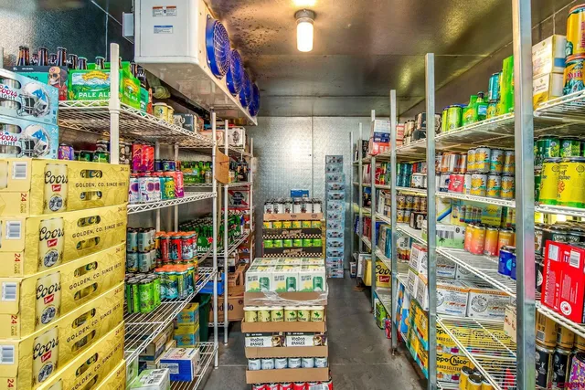 a living room with furniture a rug and a window