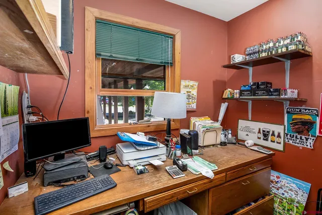 a view of swimming pool with outdoor seating and a mountain view