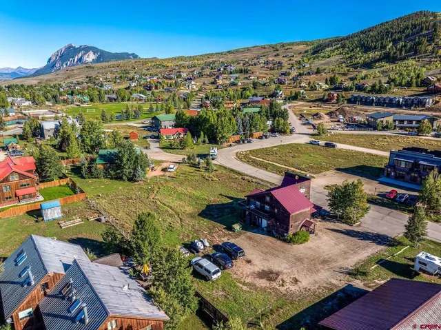 a aerial view of a house with a yard