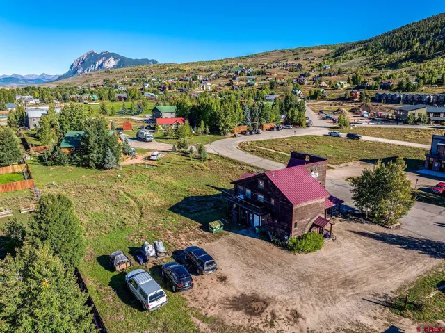 a view of a city with mountains in the background