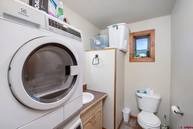 a bathroom with a toilet and a sink