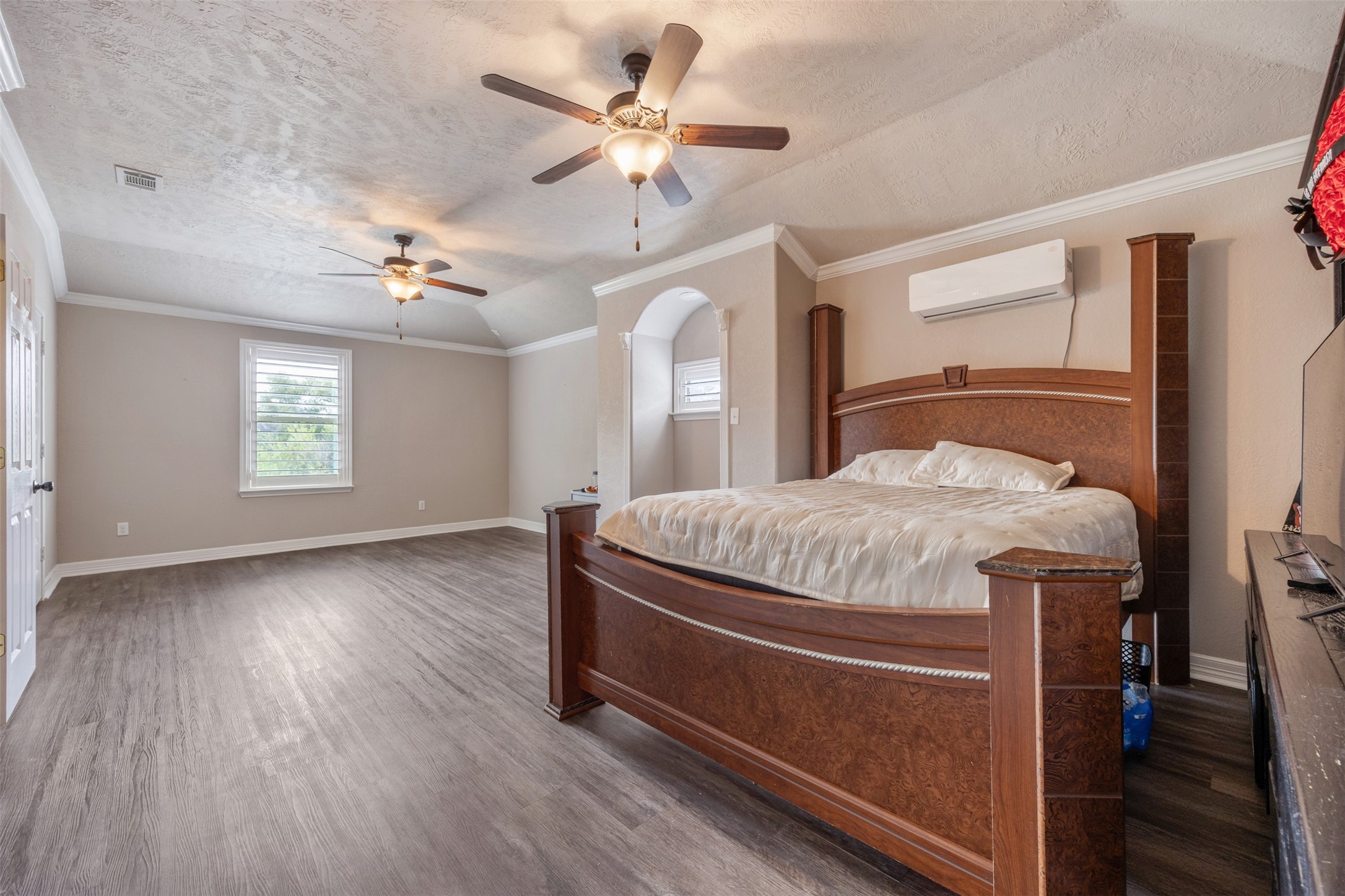 2622 Muegge Road Rosenberg, TX 77471 - Photo 26 of 28 a bedroom with a bed and a chandelier