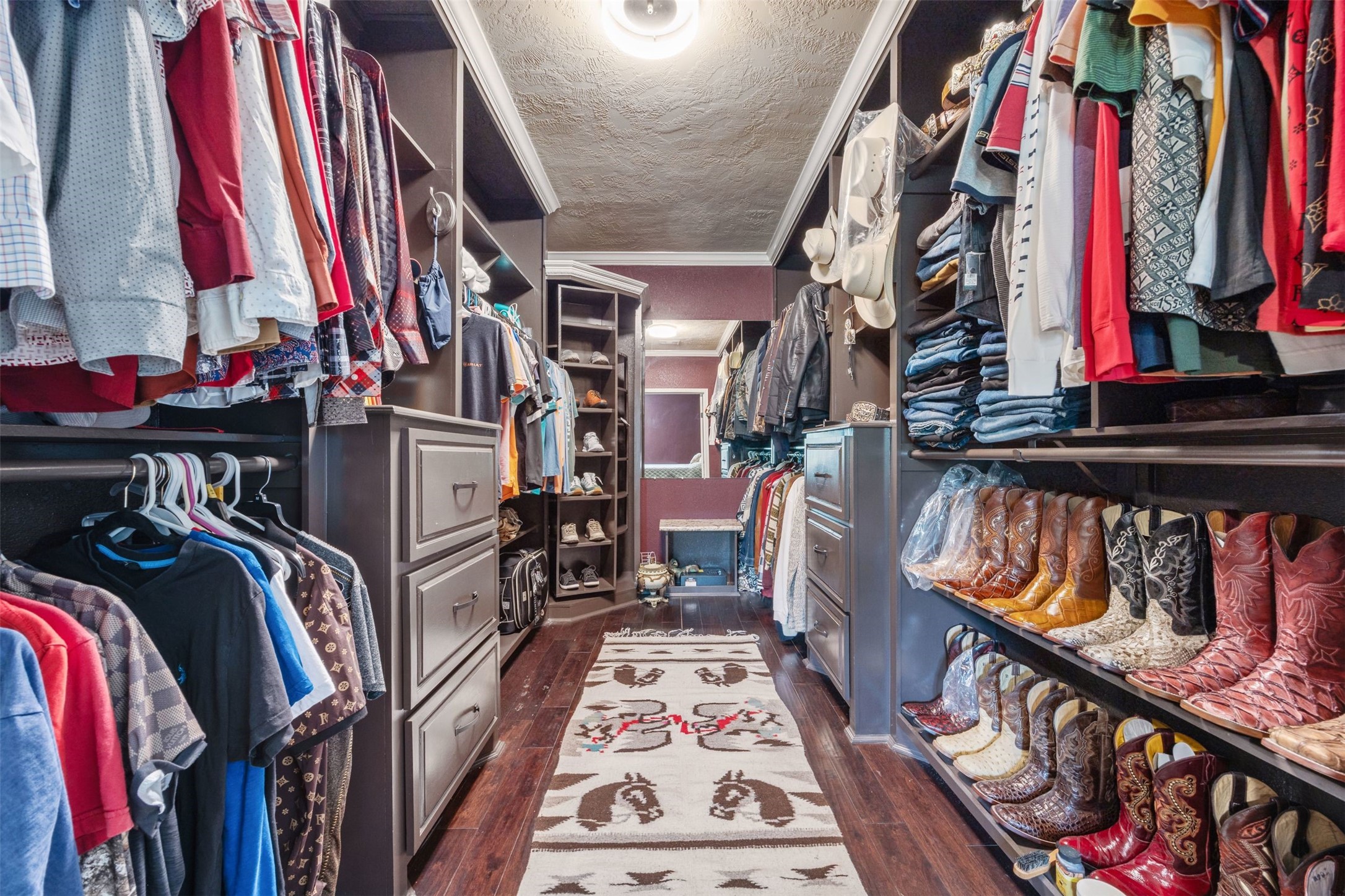 2622 Muegge Road Rosenberg, TX 77471 - Photo 10 of 28 a view of walk in closet with clothes and shoes