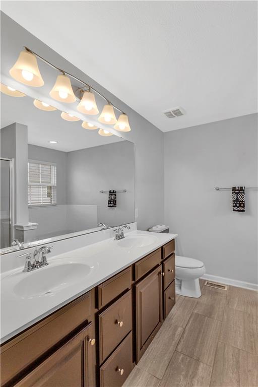 1304 Pointe View Drive Mars, PA 16046 - Photo 17 of 29 a bathroom with a sink a toilet and a mirror