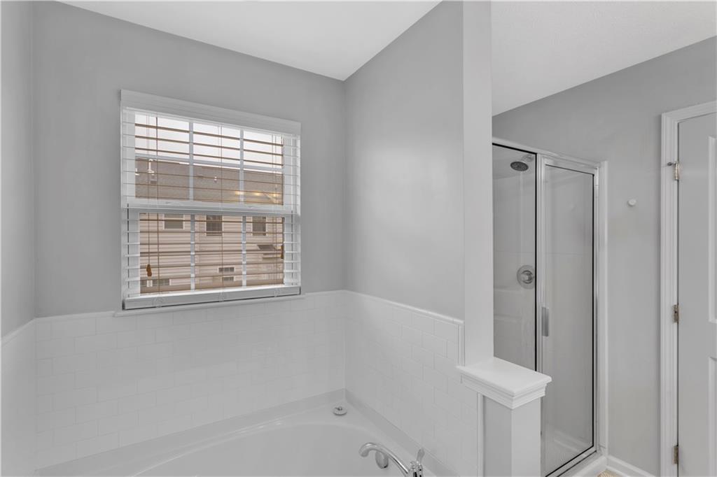1304 Pointe View Drive Mars, PA 16046 - Photo 18 of 29 a bathroom with a bathtub and shower