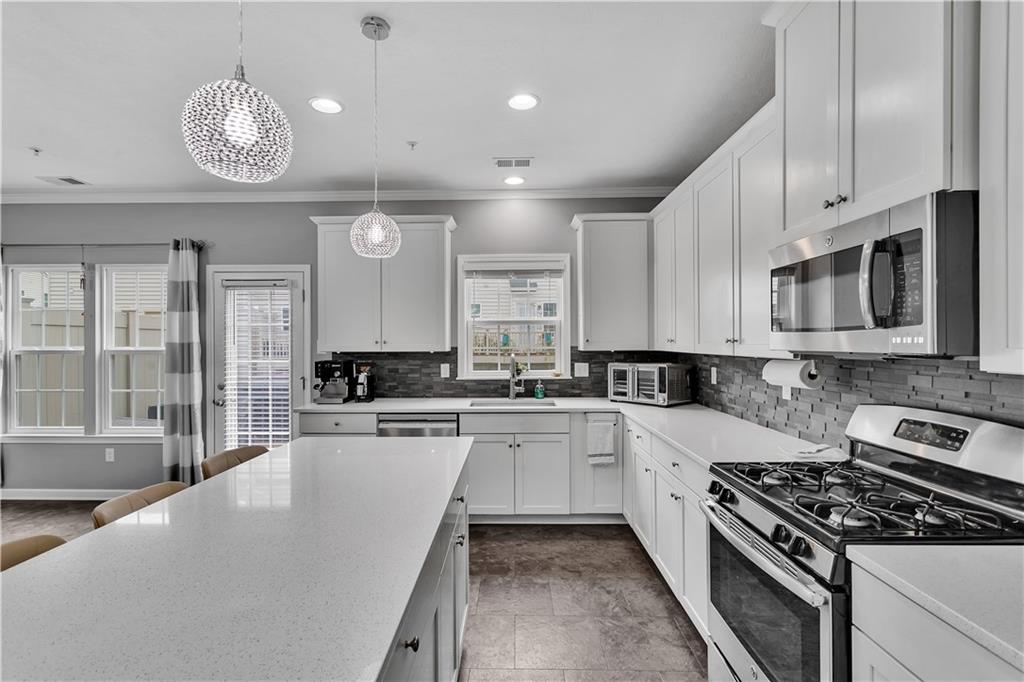 1304 Pointe View Drive Mars, PA 16046 - Photo 6 of 29 a large kitchen with stainless steel appliances granite countertop a stove and a sink