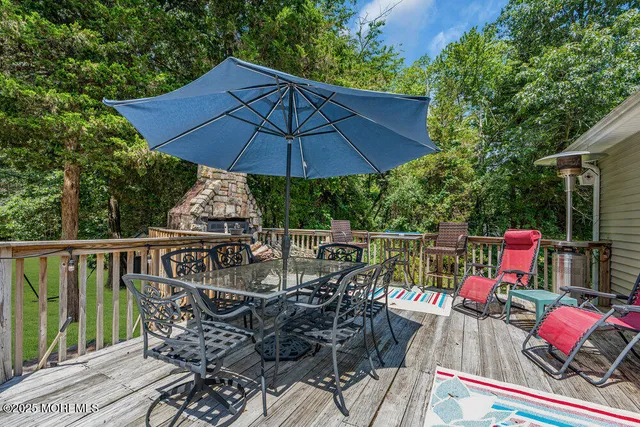 a garden with trees and wooden fence