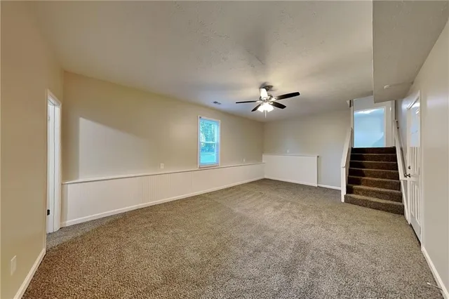 a view of a wooden deck and a yard