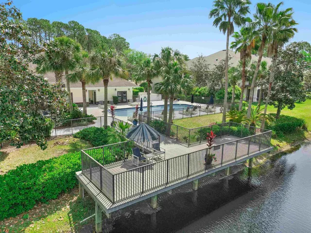 a view of house with outdoor space and swimming pool