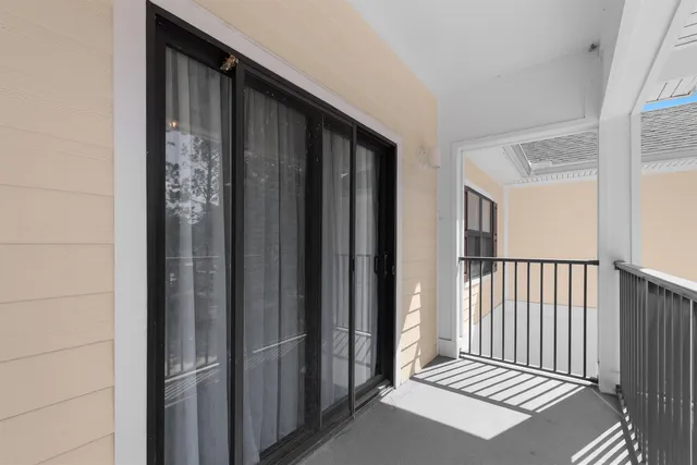 a view of a balcony with wooden floor