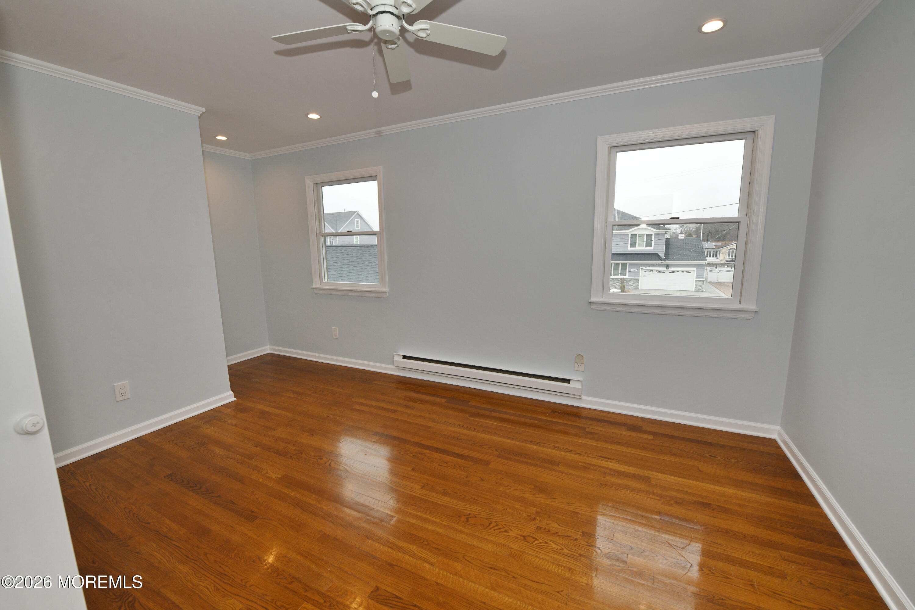 1608 Osprey Court Point Pleasant, NJ 08742 - Photo 23 of 40 an empty room with wooden floor and windows