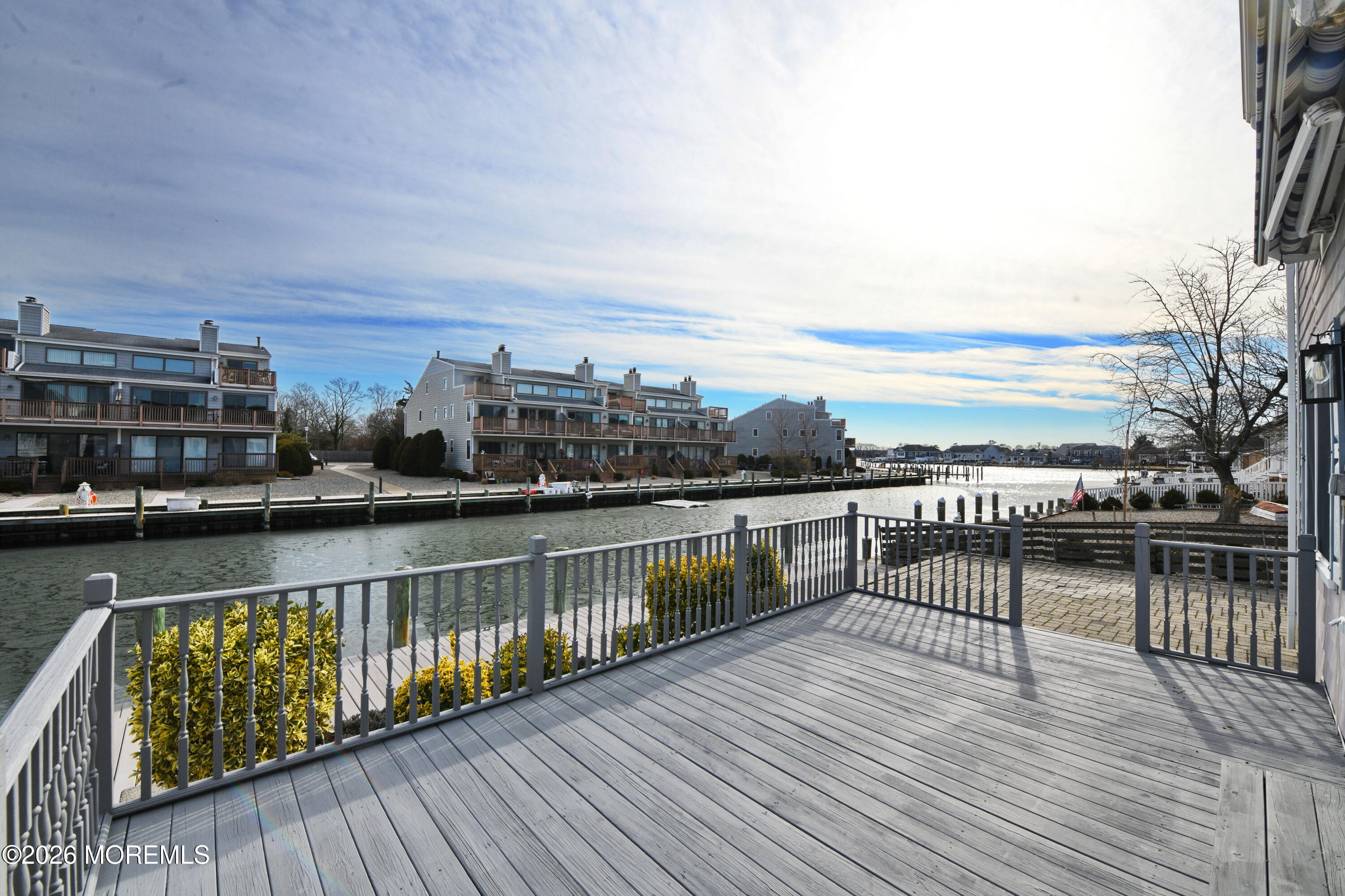 1608 Osprey Court Point Pleasant, NJ 08742 - Photo 31 of 40 a view of roof deck with two chairs and wooden floor