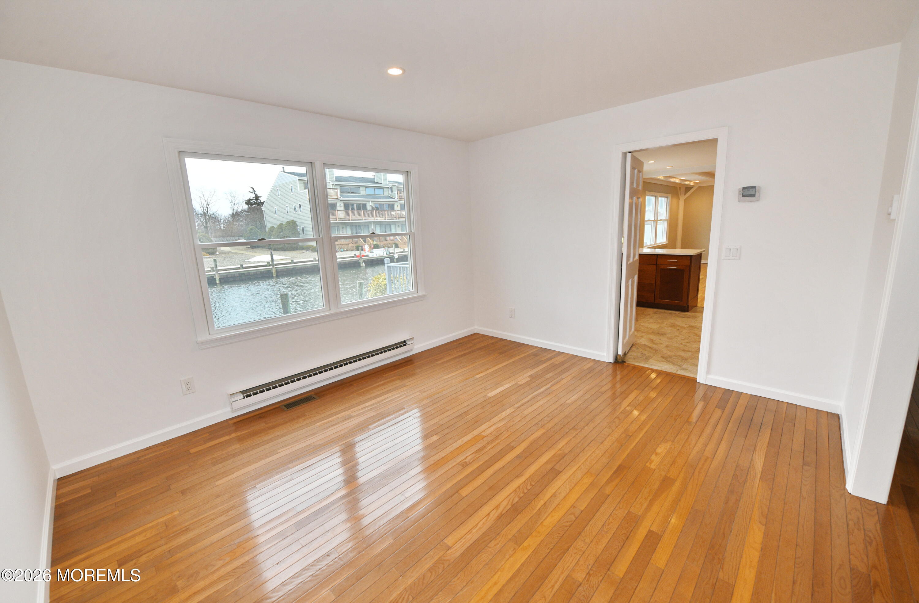 1608 Osprey Court Point Pleasant, NJ 08742 - Photo 6 of 40 an empty room with wooden floor and windows