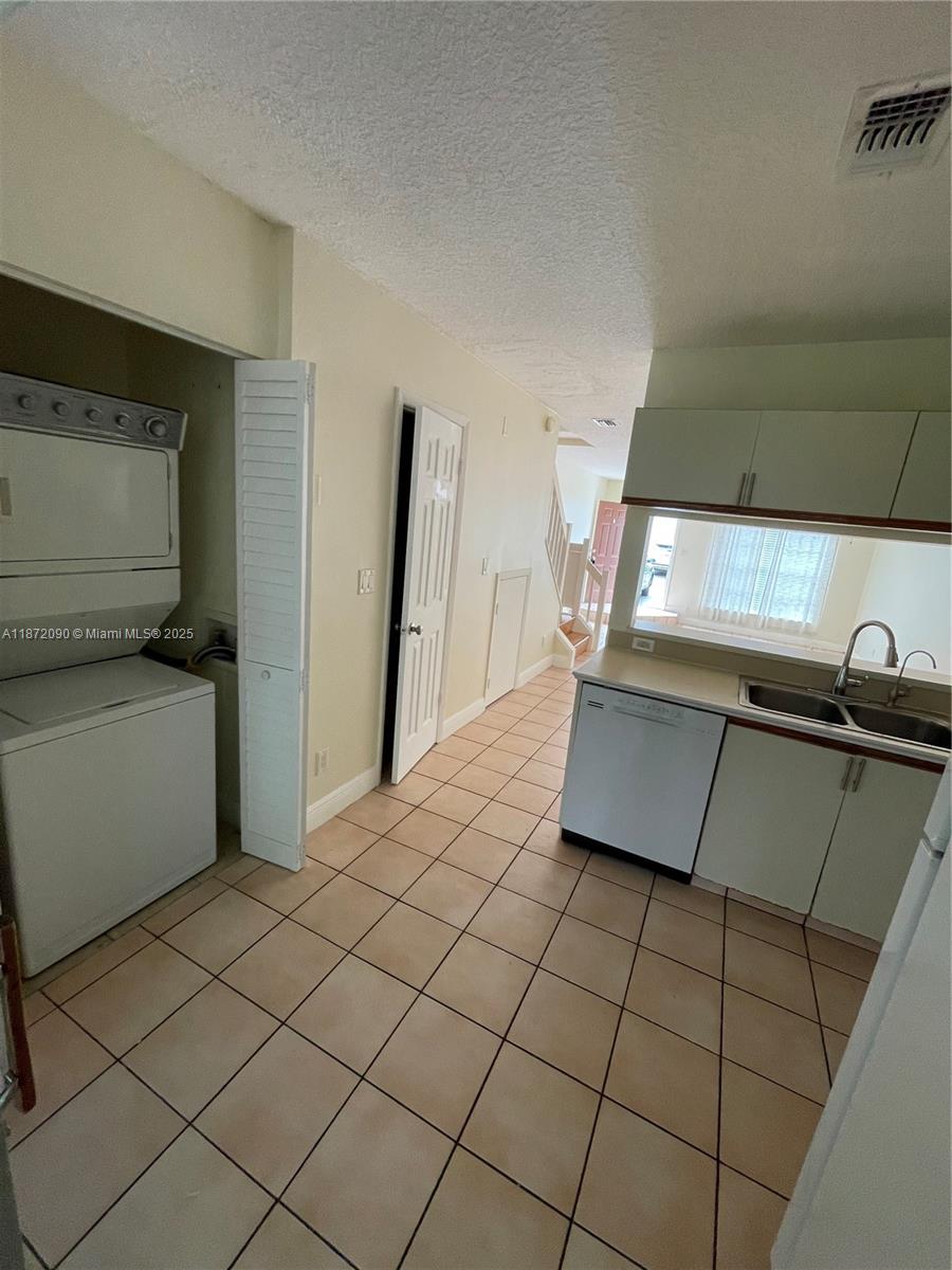 2880 Belmont Lane, Unit 2880 Cooper City, FL 33026 - Photo 3 of 16 a kitchen with a sink and cabinets