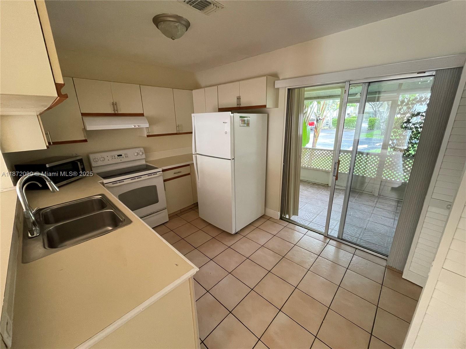 2880 Belmont Lane, Unit 2880 Cooper City, FL 33026 - Photo 5 of 16 a utility room with dryer and washer