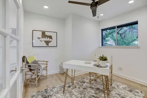 a workspace with furniture and window