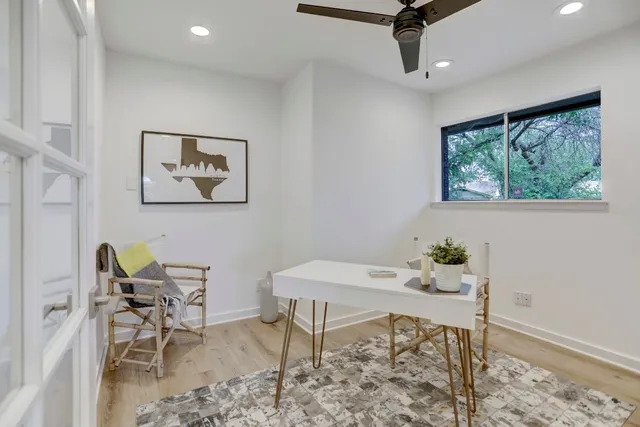 a workspace with furniture and window