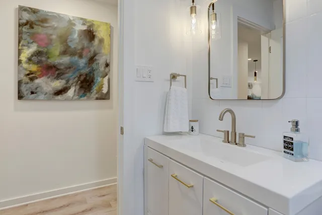 a bathroom with a sink and a mirror