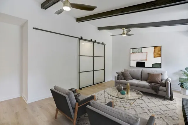 a living room with furniture and a window