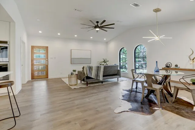 a view of a livingroom with furniture and a work space