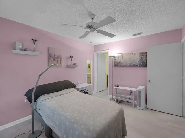 a bedroom with a bed and a table in it