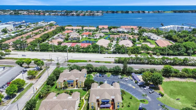 an aerial view of a house with a lake view