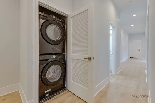 a view of a storage & utility room with washer and dryer