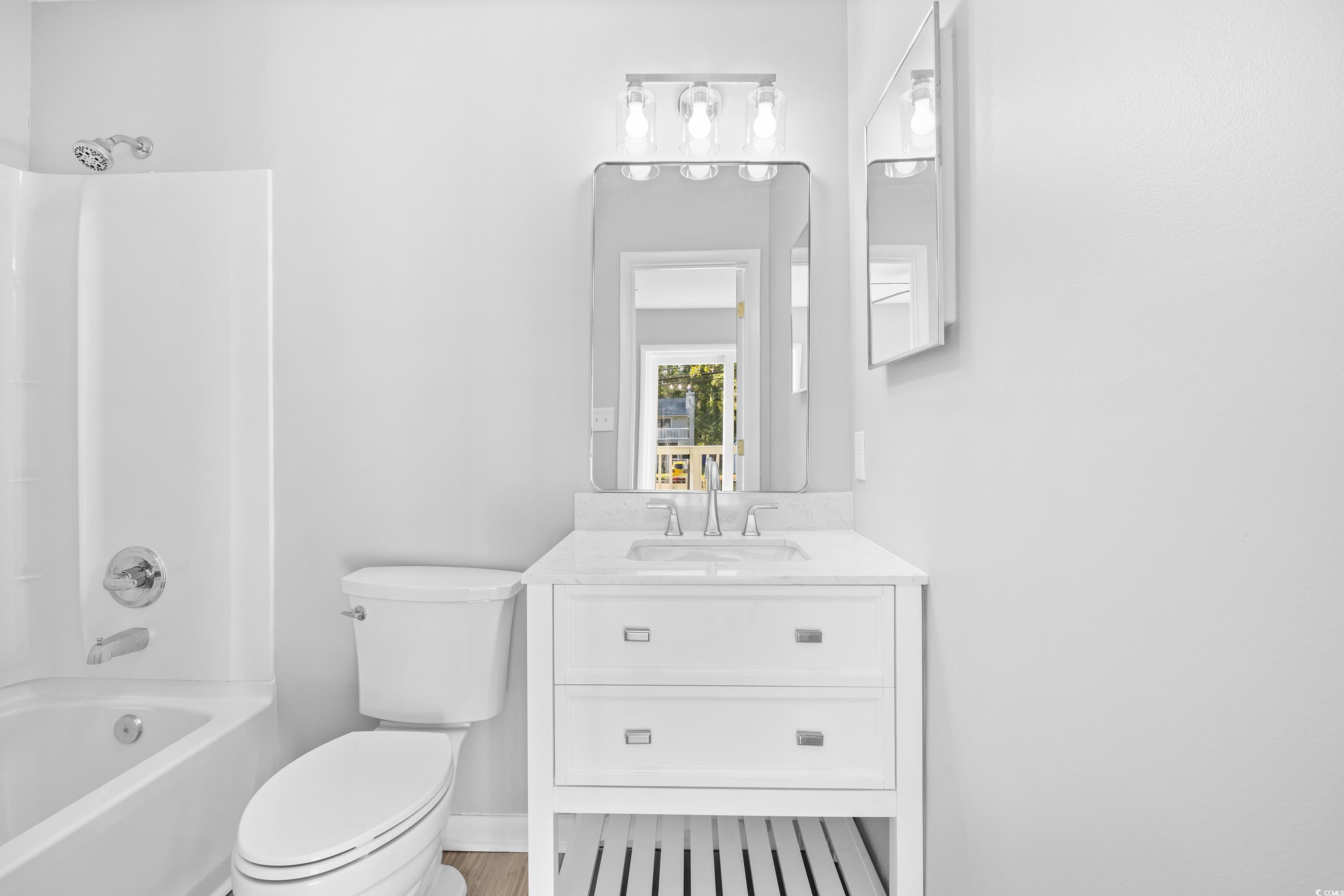 617 Surfside Drive Surfside Beach, SC 29575 - Photo 27 of 39 Full bathroom featuring tub / shower combination and vanity