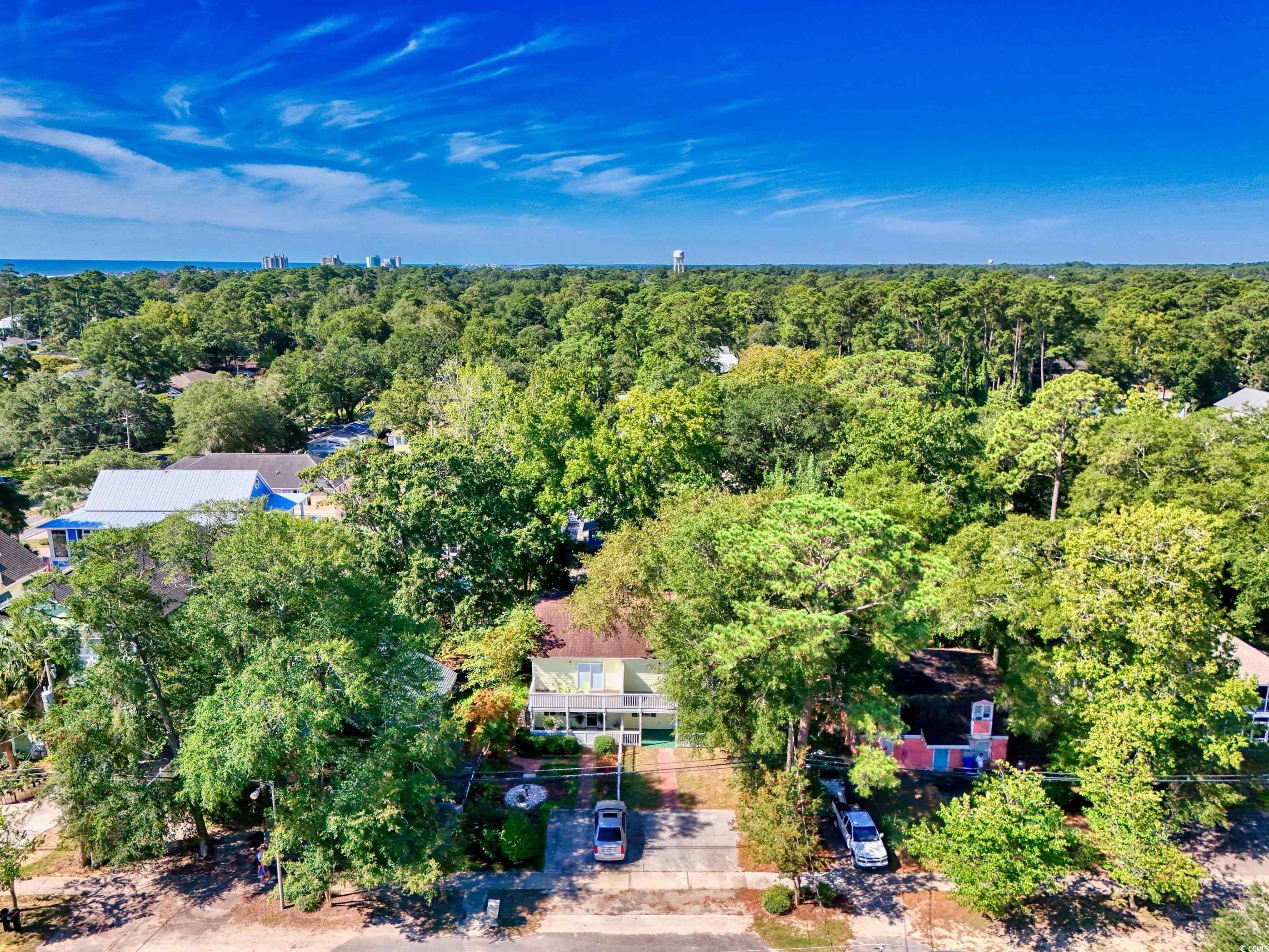 617 Surfside Drive Surfside Beach, SC 29575 - Photo 36 of 39 Aerial view of property and surrounding area with nearby suburban area and a nearby body of water