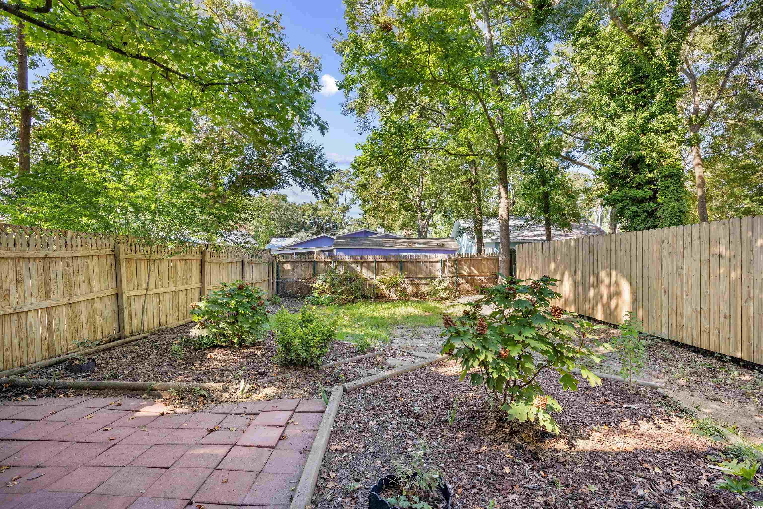 617 Surfside Drive Surfside Beach, SC 29575 - Photo 5 of 39 View of fenced backyard