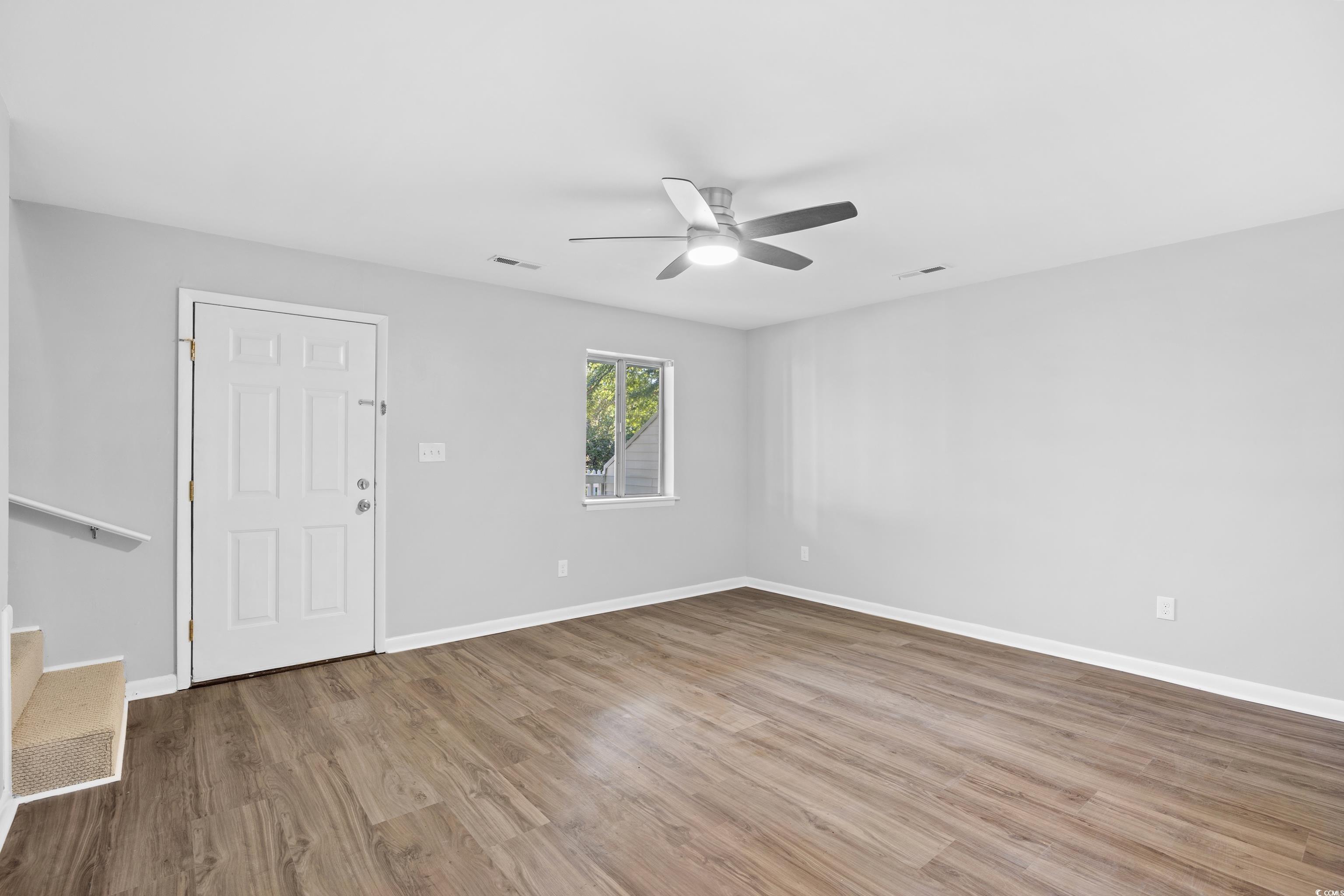 617 Surfside Drive Surfside Beach, SC 29575 - Photo 10 of 39 Entrance foyer featuring light wood-style floors, stairway, and ceiling fan
