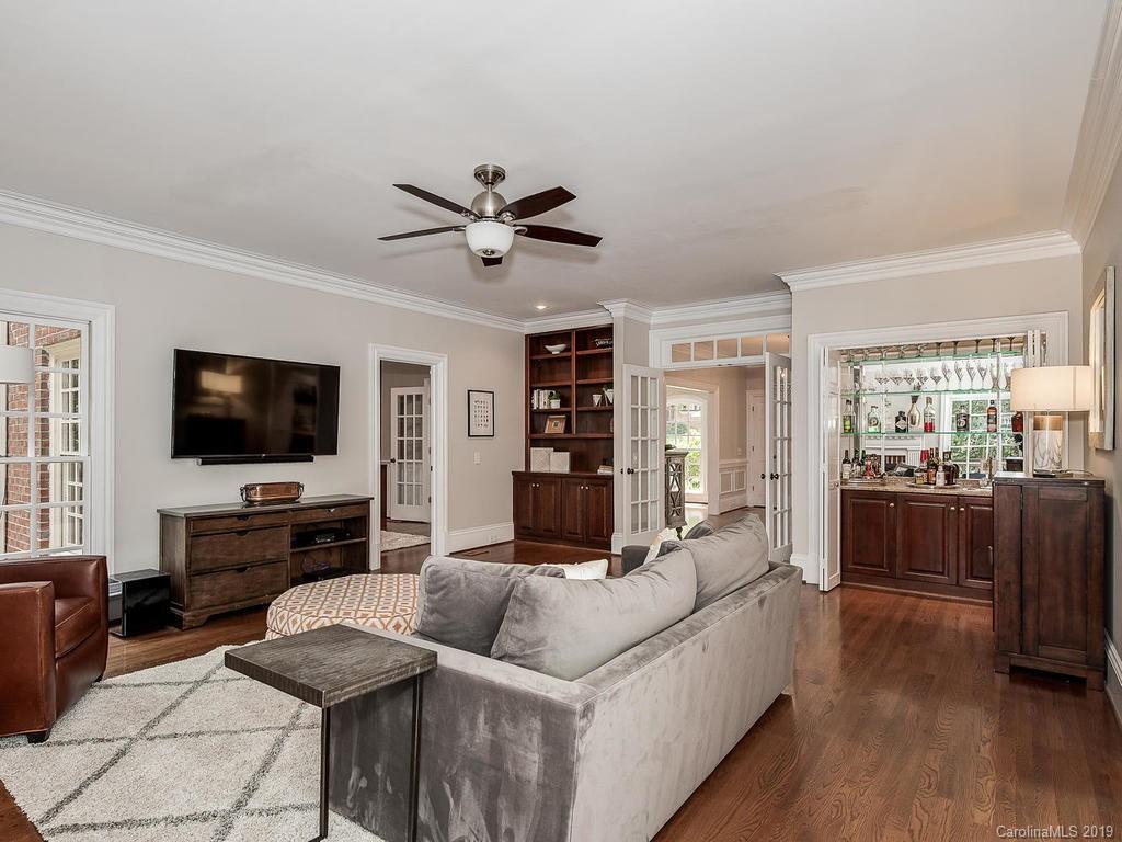 4501 Nora's Path Road Charlotte, NC 28226 - Photo 14 of 32 a living room with furniture and a flat screen tv