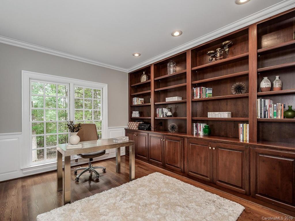 4501 Nora's Path Road Charlotte, NC 28226 - Photo 15 of 32 a view of a workspace with furniture and a bookshelf