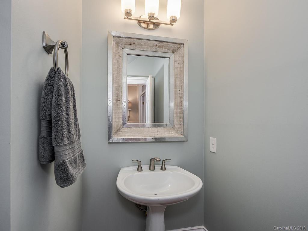 4501 Nora's Path Road Charlotte, NC 28226 - Photo 16 of 32 a bathroom with a sink a mirror and a window