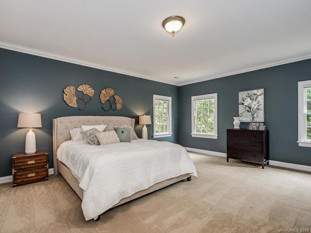 4501 Nora's Path Road Charlotte, NC 28226 - Photo 17 of 32 a bedroom with a bed and a painting on the wall