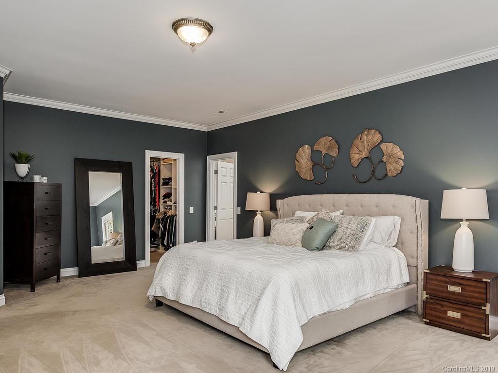 4501 Nora's Path Road Charlotte, NC 28226 - Photo 19 of 32 a bedroom with a bed and a night stand