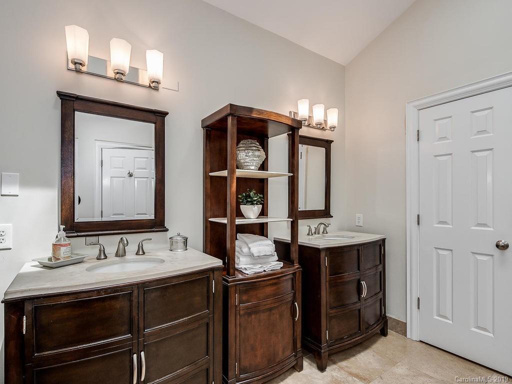4501 Nora's Path Road Charlotte, NC 28226 - Photo 21 of 32 a bathroom with a sink and a mirror