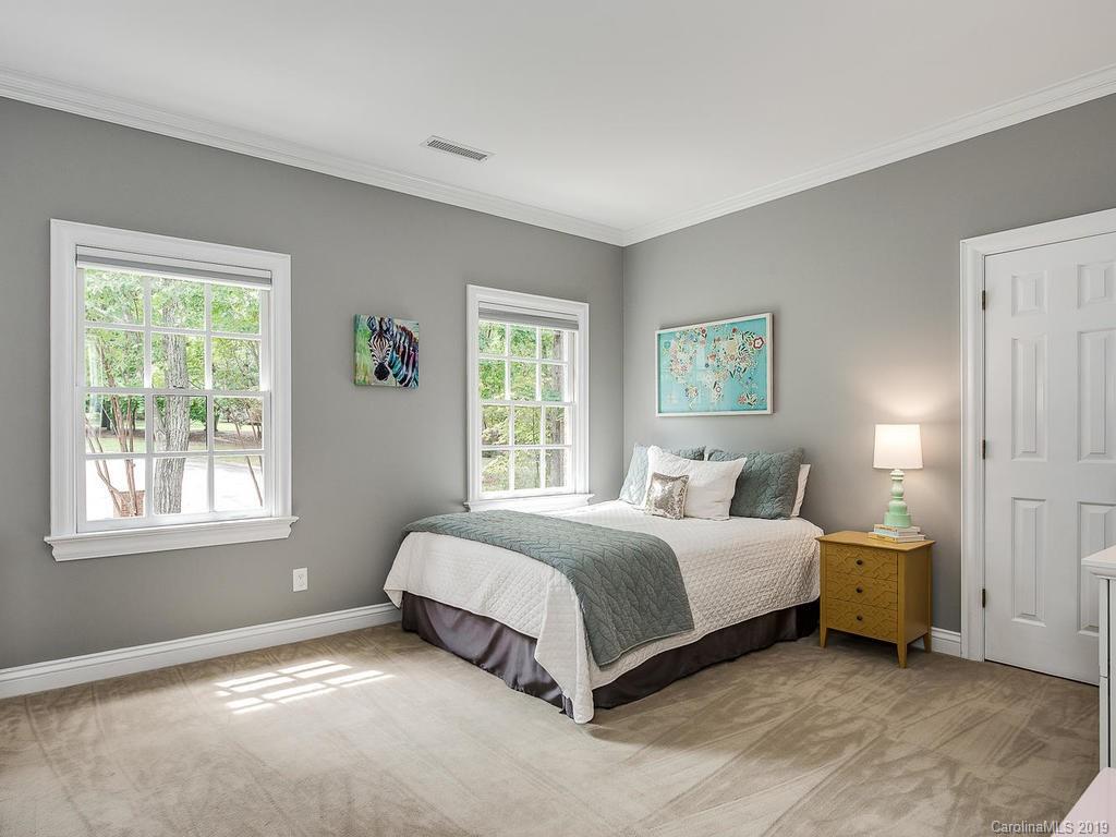 4501 Nora's Path Road Charlotte, NC 28226 - Photo 24 of 32 a a spacious bedroom with a bed and a window