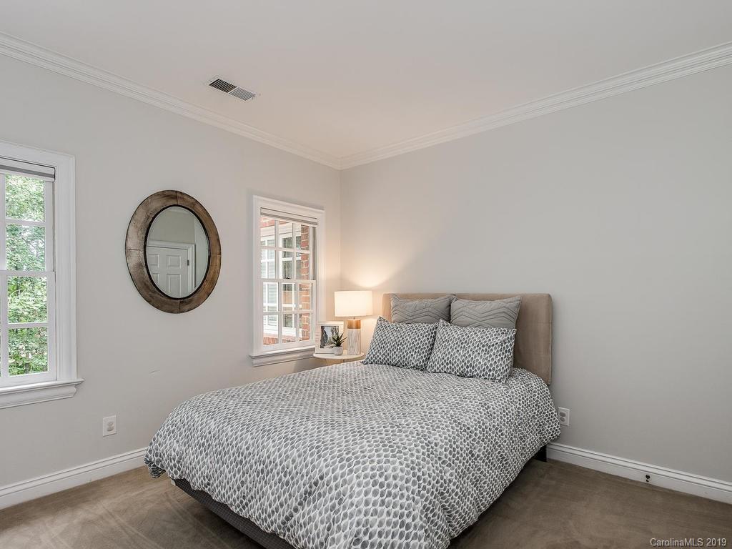 4501 Nora's Path Road Charlotte, NC 28226 - Photo 26 of 32 a bedroom with a bed and a window