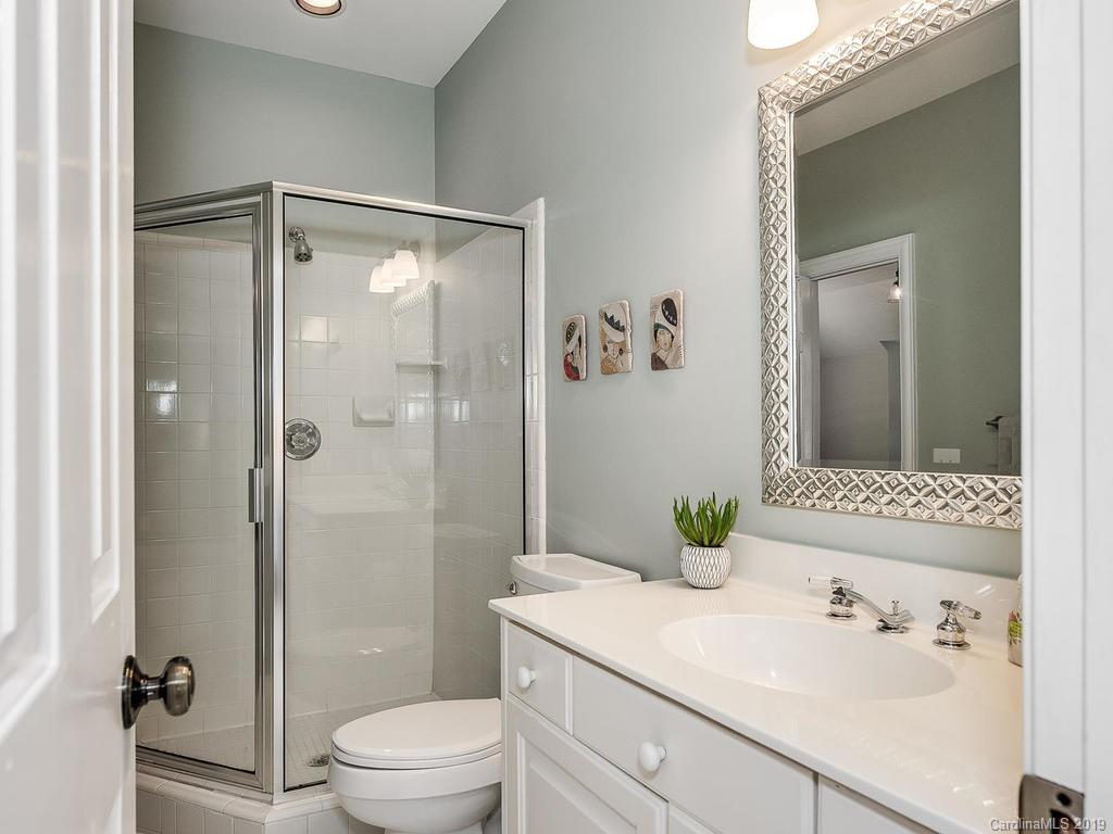 4501 Nora's Path Road Charlotte, NC 28226 - Photo 27 of 32 a bathroom with a shower sink vanity mirror and toilet
