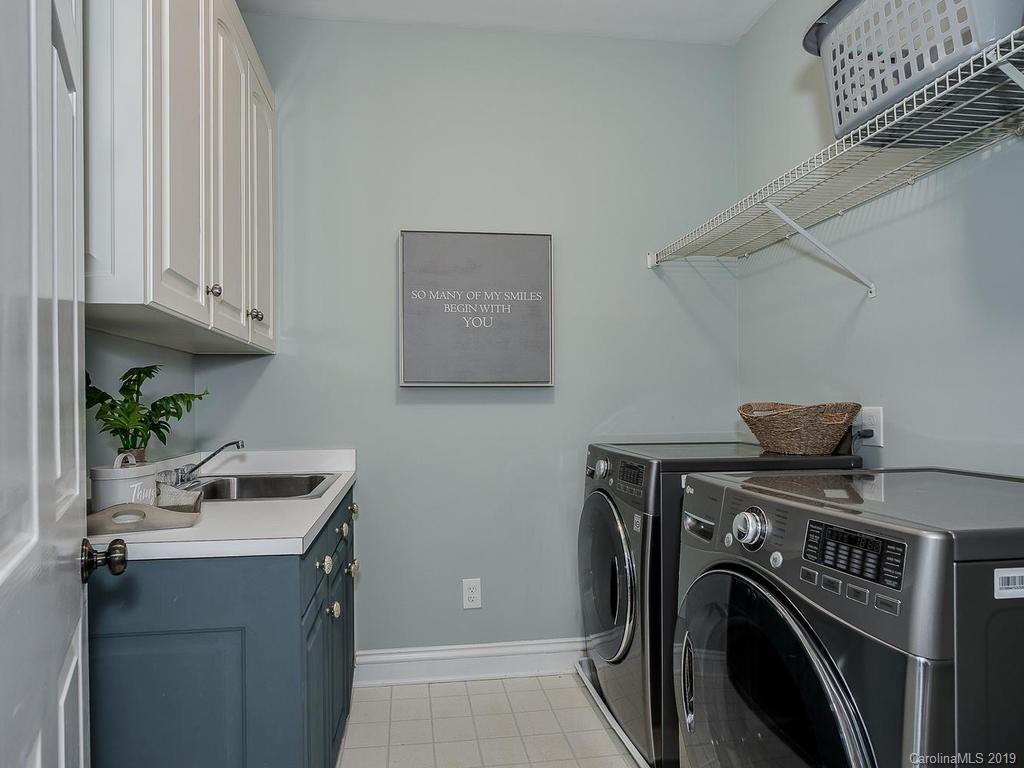 4501 Nora's Path Road Charlotte, NC 28226 - Photo 29 of 32 a view of a storage and utility room with washer and dryer