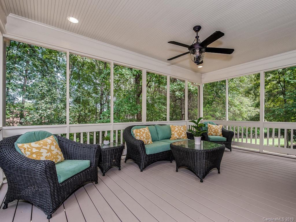 4501 Nora's Path Road Charlotte, NC 28226 - Photo 31 of 32 a living room with furniture and a floor to ceiling window