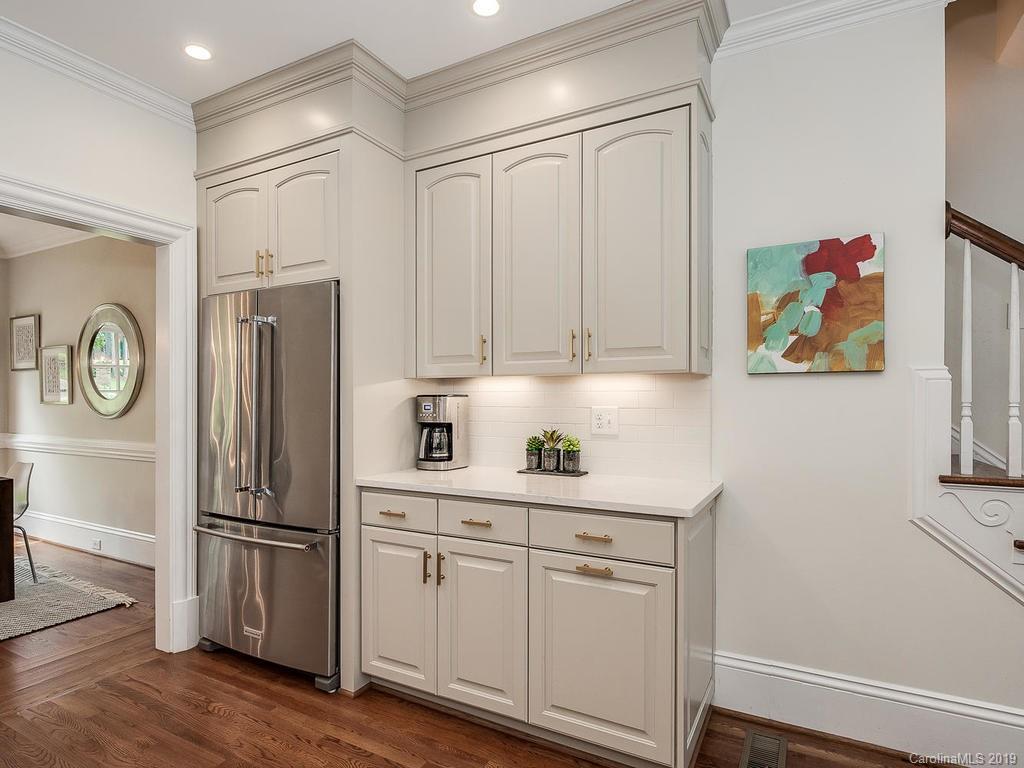 4501 Nora's Path Road Charlotte, NC 28226 - Photo 8 of 32 a kitchen with stainless steel appliances a refrigerator and a stove top oven