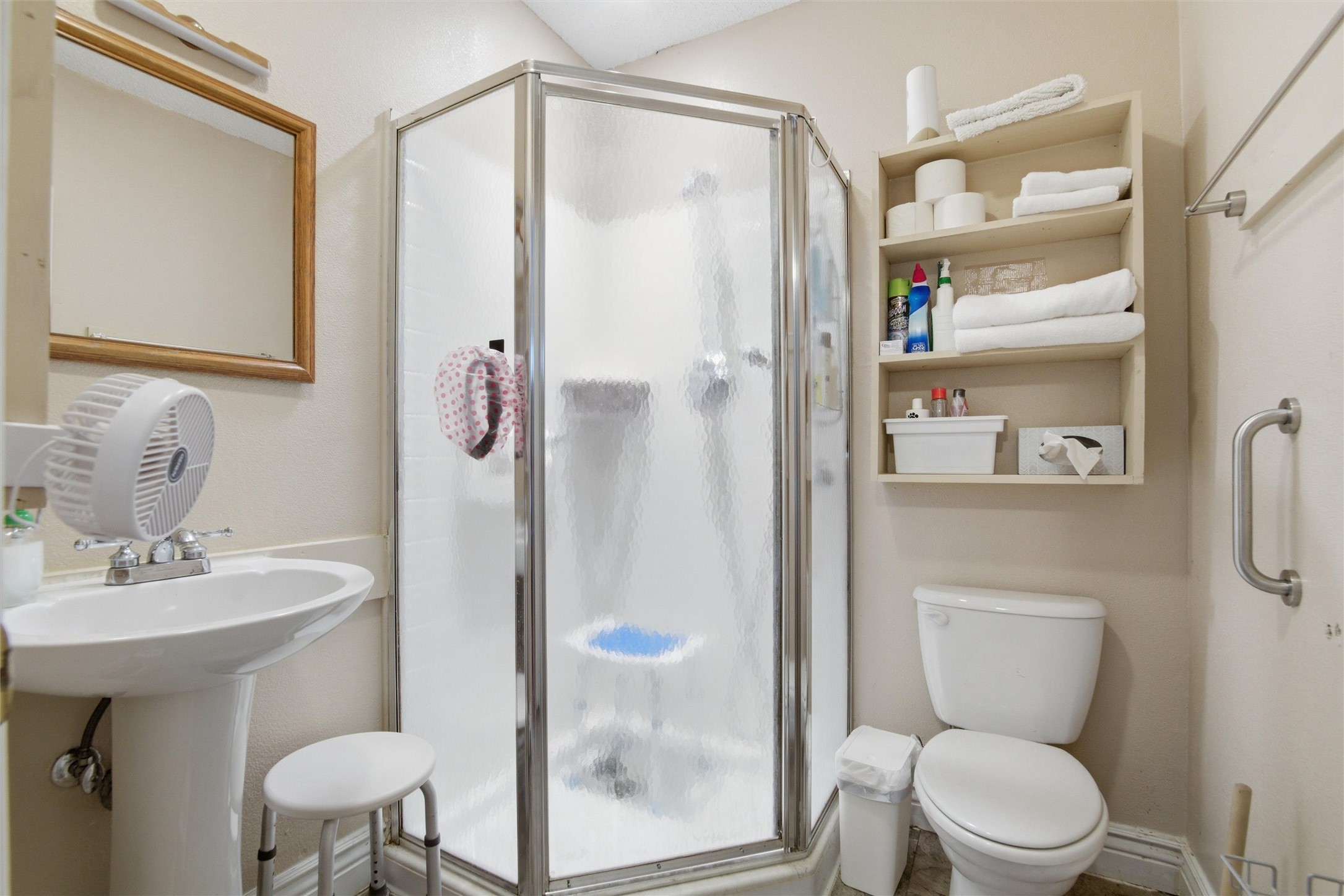 2000 Magazine Street Austin, TX 78727 - Photo 17 of 30 Functional full bathroom featuring a glass-enclosed shower stall and pedestal sink.