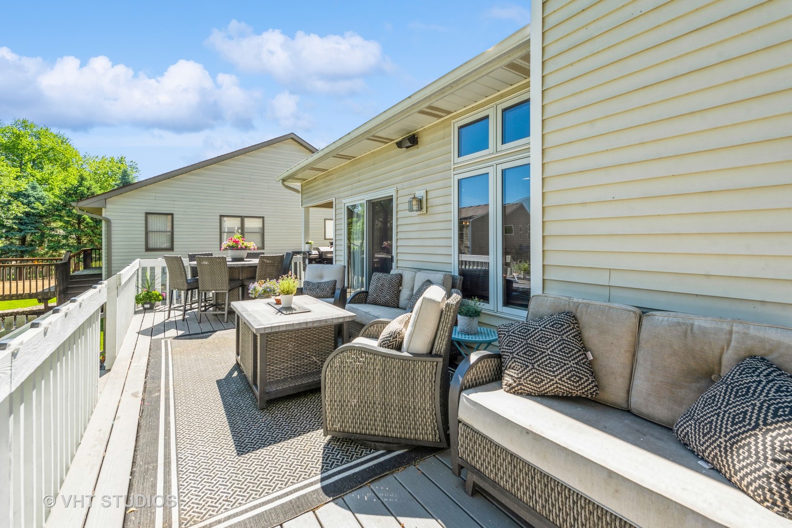 751 Roger Road Woodstock, IL 60098 - Photo 24 of 28 a balcony with furniture and a potted plant