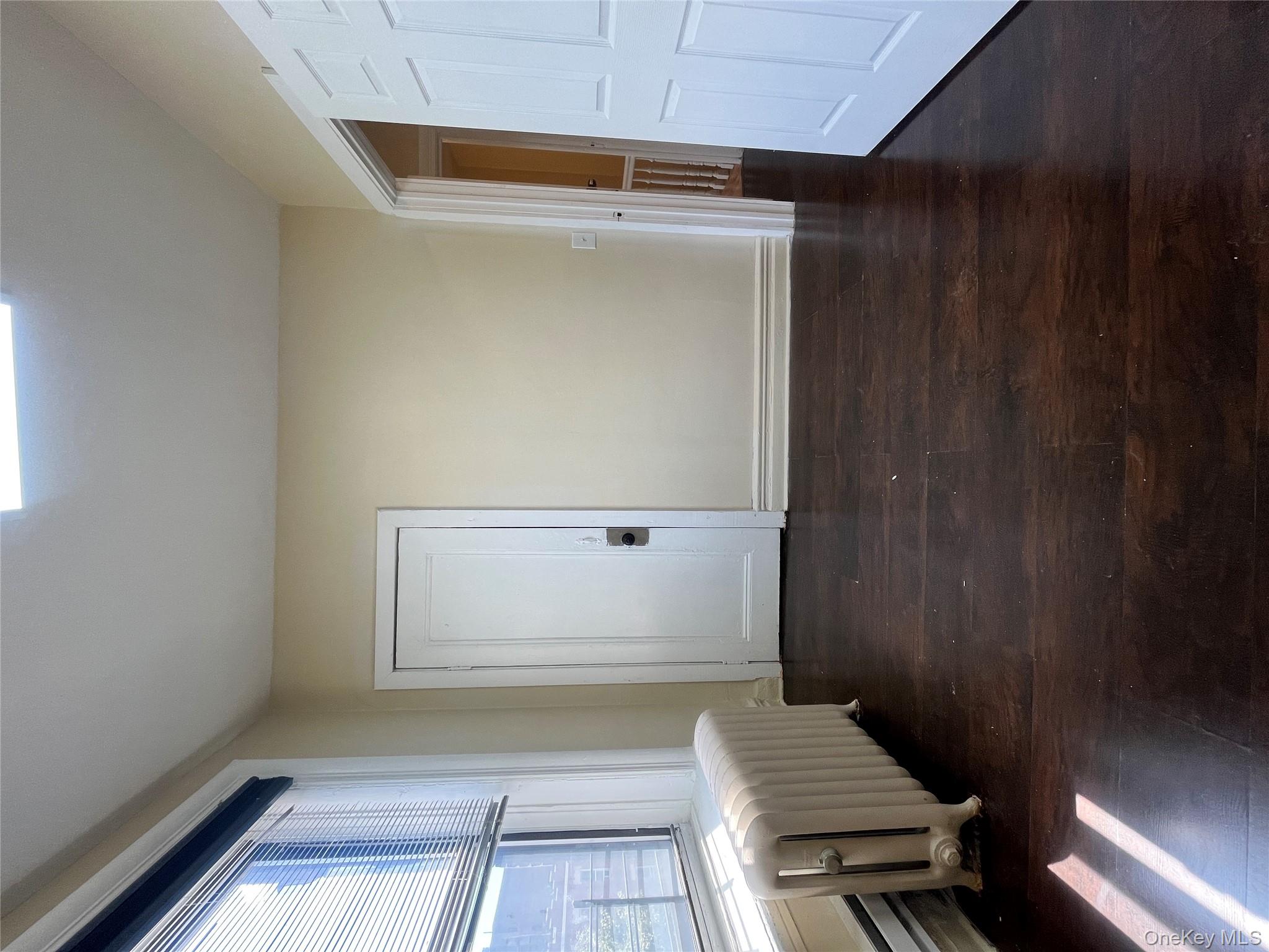 30 West Kingsbridge Road, Unit 3 Bronx, NY 10468 - Photo 7 of 14 a spacious bedroom with a bed and wooden floor