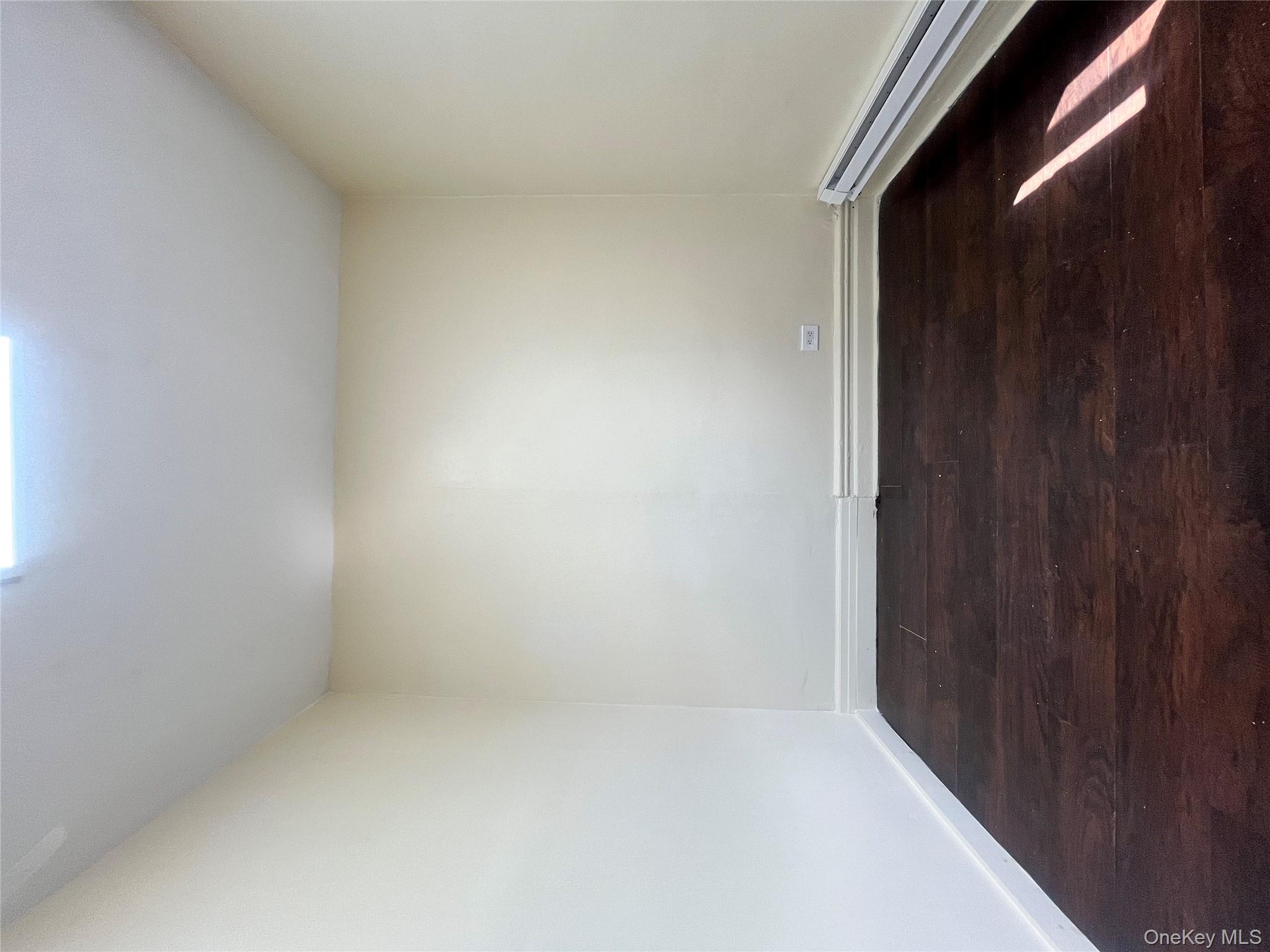 30 West Kingsbridge Road, Unit 3 Bronx, NY 10468 - Photo 8 of 14 a view of an empty room and wooden floor