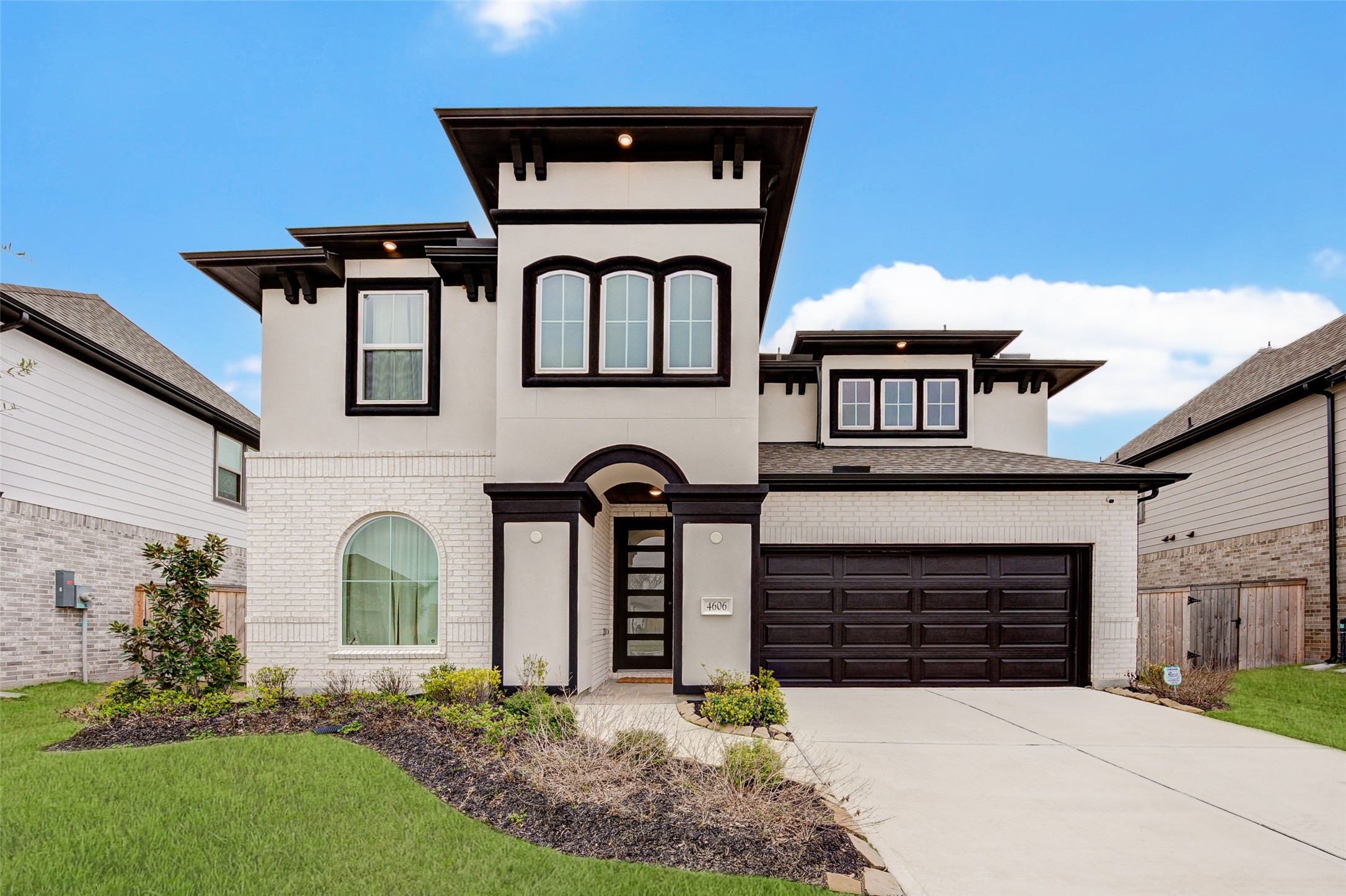 a front view of a house with garden