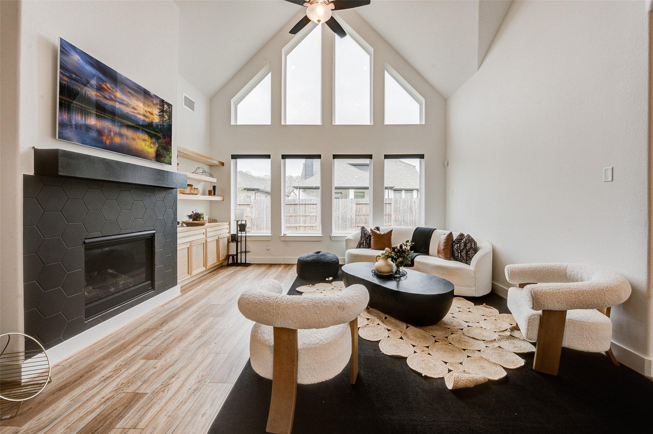 4606 Wax Myrtle Court Fulshear, TX 77441 - Photo 11 of 36 a dining room with furniture a fireplace and wooden floor