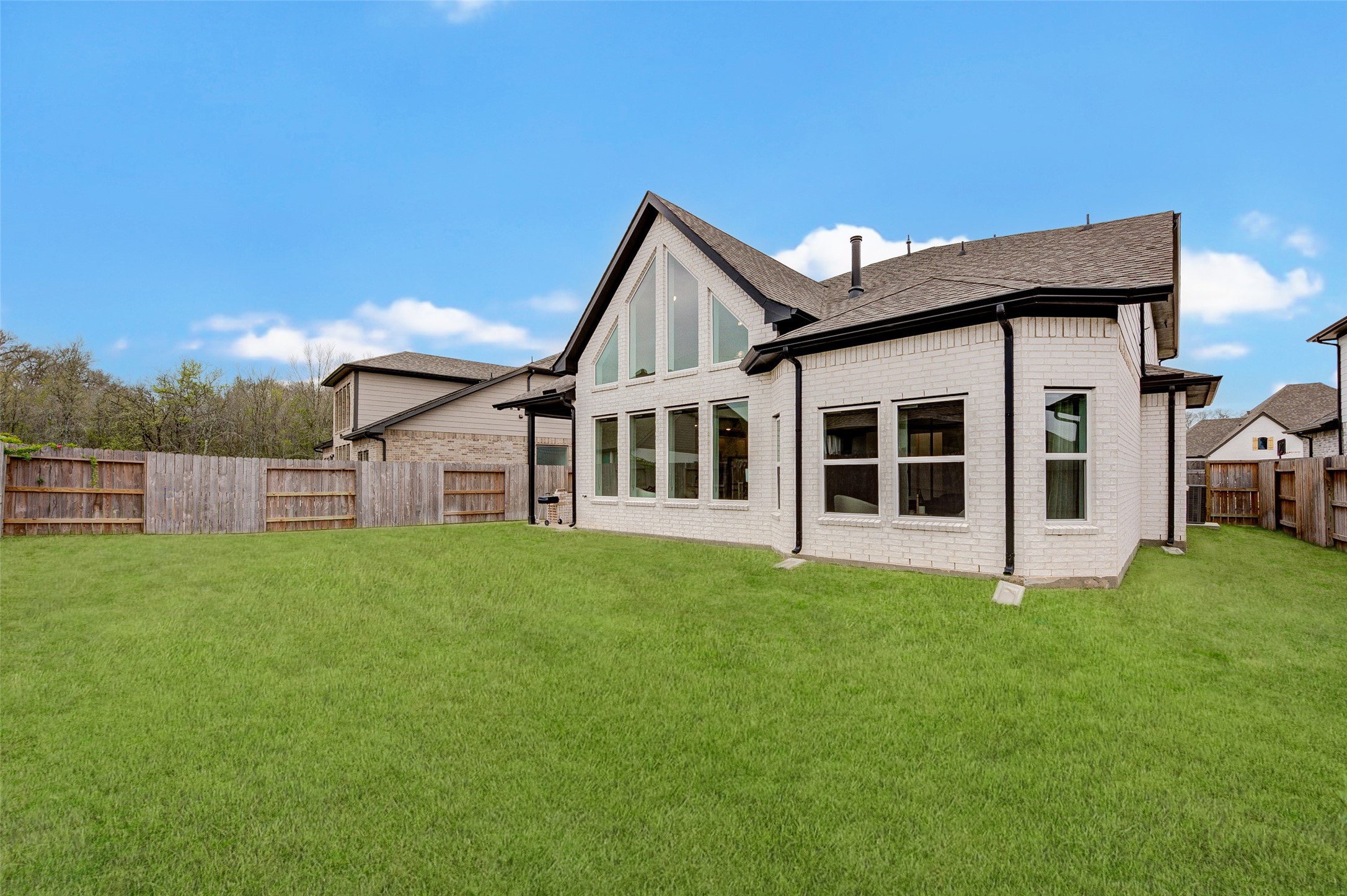 4606 Wax Myrtle Court Fulshear, TX 77441 - Photo 35 of 36 a view of a house with a yard